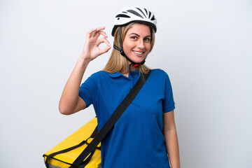 Young caucasian woman with thermal backpack isolated on white background showing ok sign with fingers