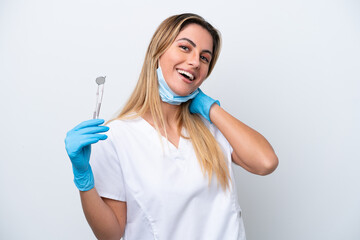 Dentist woman holding tools isolated on white background laughing