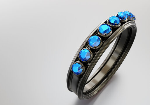 Ring with blue diamonds. Visualization of ring on gray background. Unisex ring with blue gemstones. Place for text. Jewelry close-up. Dark silver jewelry. Jewelry for men. 3d rendering.
