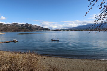Naklejka premium A scene of Kawaguchi-ko Lake at the foot of Mt.Fuji in Minamitsuru-gun County in Yamanashi Prefecture in Japan 日本の山梨県南都留郡にある河口湖の風景