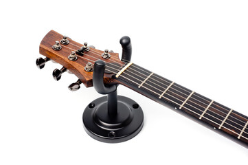Wall mounted metal holder for acoustic or electric guitar.