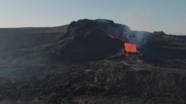 Dangerous Icelandic active volcano Fagradalsfjall in Iceland is erupting in 2021 with hot lava, explosion smoke and floating magma. Beautiful landscape, High quality 4k footage in slow motion