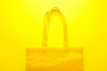 Fabric tote bag on yellow background