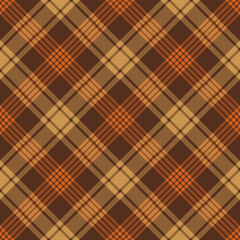 Brown and orange argyle tartan plaid. Scottish pattern fabric swatch close-up. 