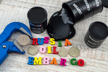 concept of barrel of oil with words sanctions, national flag and ruble in wise