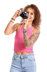 Beautiful tattooed woman with photo camera isolated on white