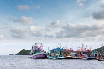 Fishing boats at the morning under blue sky and cloud