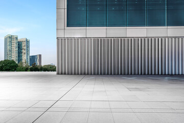 Fototapeta premium Empty square floor and glass wall building in Hangzhou, China.