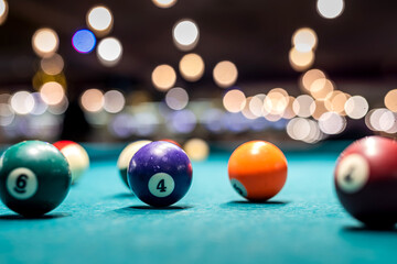 Billiard balls on the table and the player's hands are preparing to strike in the start mode.