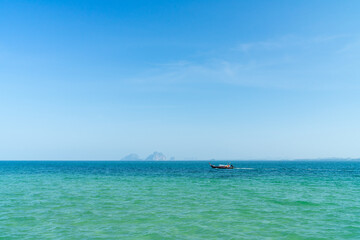 Fototapeta na wymiar Sea and taxi boat taking traveler to the island