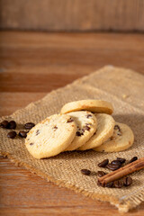 Coffee cookie on wooden table decorated with coffee beans