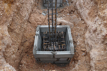 steel reinforced concrete columns and footing in block concrete framework.