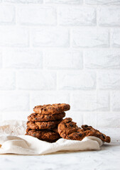 Oatmeal cookies with chocolate chips on a light background. Breakfast concept.