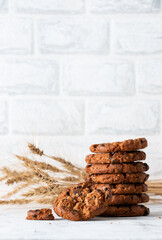 Oatmeal cookies with chocolate chips on a light background. Breakfast concept.