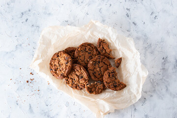 Oatmeal cookies with chocolate chips on a light background. Breakfast concept.