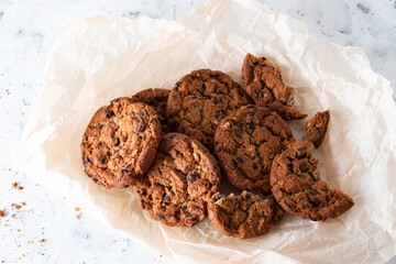 Oatmeal cookies with chocolate chips on a light background. Breakfast concept.