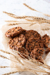 Oatmeal cookies with chocolate chips on a light background. Breakfast concept.