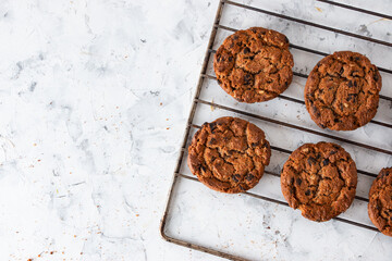Oatmeal cookies with chocolate chips on a light background. Breakfast concept.