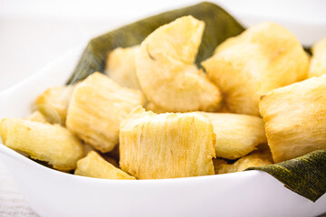 fried cassava, snack made from cassava root and served fried with lettuce, traditional south american restaurant food garnish