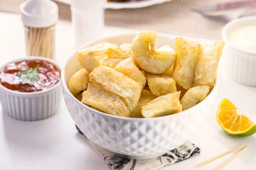 fried cassava, snack made from cassava root and served fried with lettuce, traditional south american restaurant food garnish