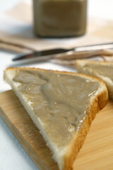 Homemade sunflower seeds butter or spread with roasted seeds. Selective focus. Vertical photo