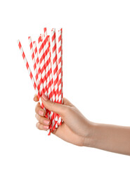 Female hand with stylish straws for drinks on white background