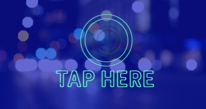Image of tap here text over cityscape at night on blue background - Powered by Adobe