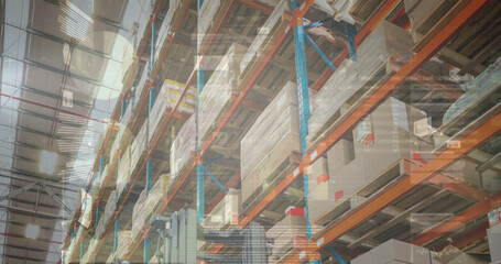 Image of financial data processing over empty warehouse