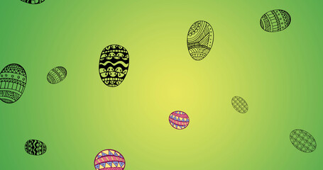 Image of easter eggs falling on green background