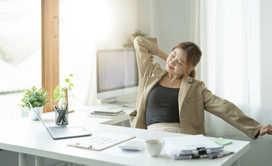 Young asian business woman having break and resting after solving task, business relaxing concept.