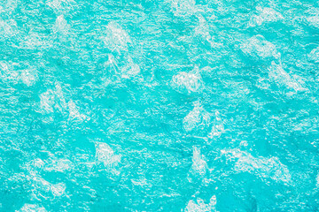 aquamarine turquoise water in a bubbling pool with hydro massage, texture background of clear water