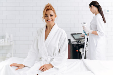 Obraz premium Smiling female client satisfied with result after cosmetic procedure