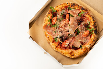 Banner close-up of Delicious pizza in a box on a white background. Top view of hot pizza. With copy space for text.