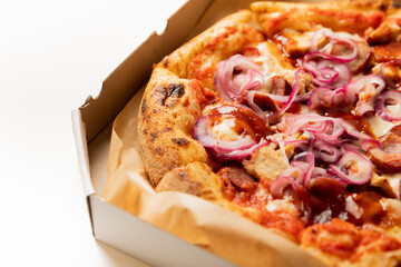Pepperoni pizza in a box isolated on white background.Fresh fragrant and hot pizza.Copy space.