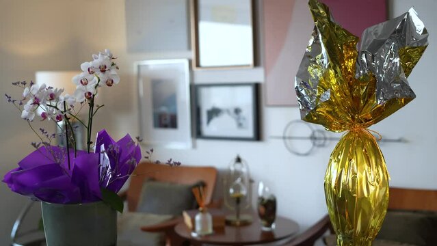 Easter egg with a flower. Multicolored Easter eggs wrapped in foil.
