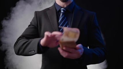 Headless businessman on black background money flipping with blasting smoke 4K
 - Powered by Adobe