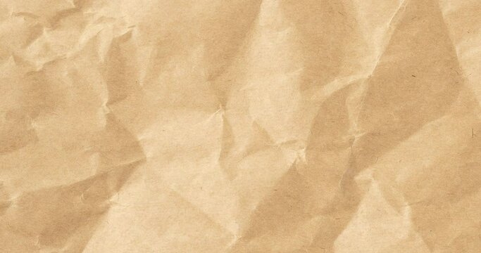 Wrinkled sheet of brown paper. Textured backdrop