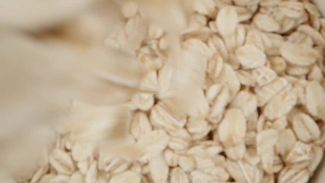 I take out a spoon from a jar of oatmeal, top view. Slider Dolly close-up. Laowa Probe