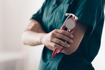 Fototapeta premium Young Doctor with stethoscope tools at clinic. Medicine and health care concept.