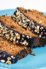 Pieces of zucchini dough with nuts and raisins. White background