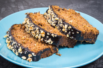 Homemade pastry made of zucchini with nuts and raisin on backgrond of concrete