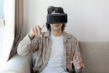 Man wearing virtual reality glasses is playing a 3D game with excitement, Man in glasses of virtual reality, VR, Future games, Gadgets, Technology, White background.., VR game concept. ..