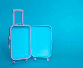 Fully opened blue suitcase, on a blue background, top view. Vacation, travel concept. copy space