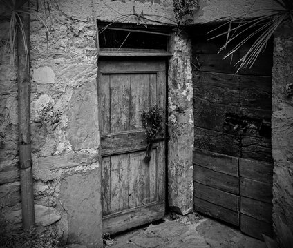 Old wooden doors in Poffabro, an historic medieval village in the Val Colvera valley in Pordenone province, Friuli-Venezia Giulia, north east Italy
