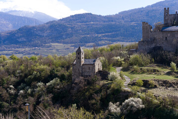 Fototapeta na wymiar Beautiful medieval catholic church and castle Basilique de Valère (Valeria) on a hill at City of Sion on a sunny spring day. Photo taken April 4th, 2022, Sion, Switzerland.