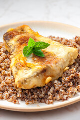fried carp with bulgur and mint