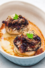 champignongs stuffed with onion and dry tomatoes
