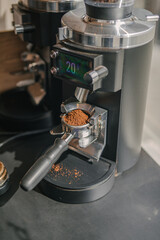 Vertical shot of a coffee shop espresso grinder