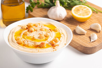 Delicious hummus with chickpeas, olive oil, lemon and pita bread. Vegetarian food concept.
