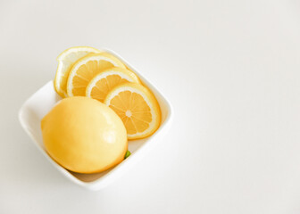 lemons sitting in a bowl